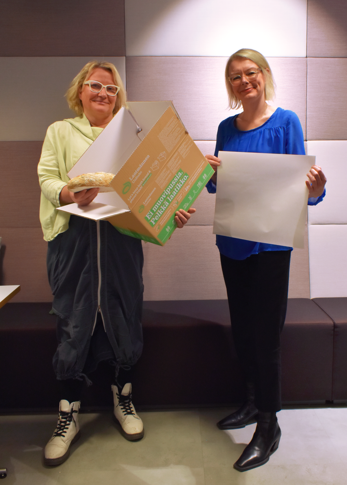 Riikka Salokannel and Maarit Relander with the new co-created packaging and Asendo paper